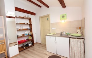 Fridge, stovetop, coffee/tea maker, cookware/dishes/utensils