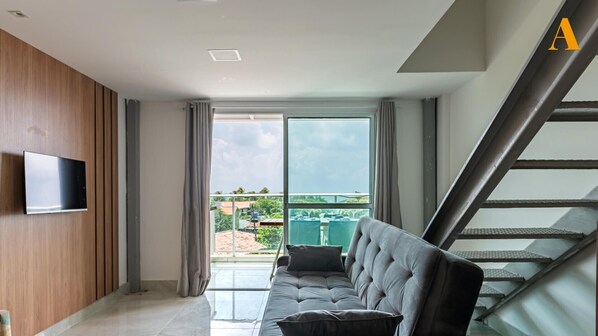 Apartment | Living area | 42-inch flat-screen TV with digital channels