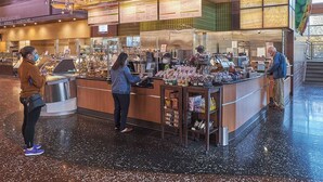 A food court with multiple food stations and a variety of food items displayed. - Remodeled! Beaverton 2BR/2BA Fenced Backyard Extended Stays (Beaverton)
