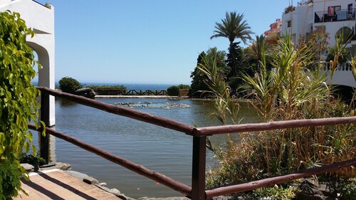 Enjoy views, Capistrano Playa 709, right above Burriana beach, Nerja