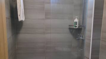 Shower, towels, soap, toilet paper