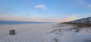 A beach with a building on the right side. -  Name of property Laguna Haven getaway (Panama City Beach)
