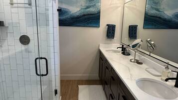 Shower, towels, soap, toilet paper