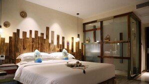 A modern bedroom with a large bed, wooden headboard, and a glass cabinet. - Shuiyue Qinghua Hotel (Deqing)