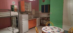 Fridge, cookware/dishes/utensils, dining tables