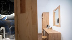 A modern bathroom with a wooden vanity, a sink, and a mirror. - Antalya D&D Terrace (Antalya)