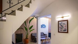 A modern interior with a staircase, seating area, and a D&D sign. - Antalya D&D Terrace (Antalya)