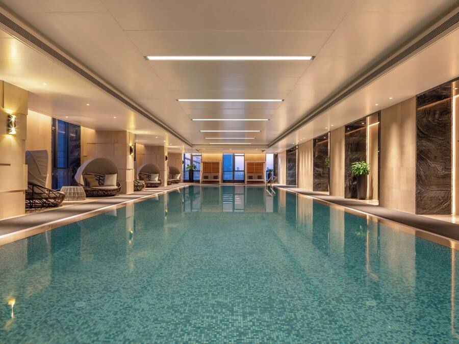 Indoor pool, open 6:00 AM to 11:00 PM, pool umbrellas, pool loungers