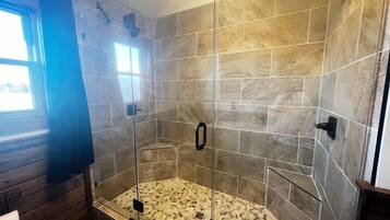 Shower, hair dryer, towels, toilet paper