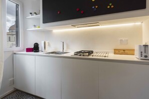 Fridge, stovetop, coffee/tea maker, cookware/dishes/utensils