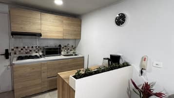 Fridge, microwave, stovetop, coffee/tea maker