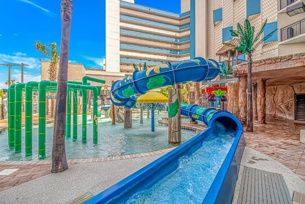 A water park with slides and climbing structures.