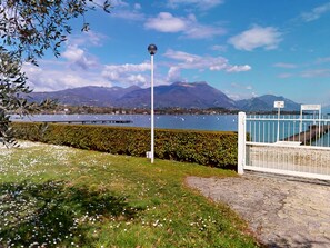 Enjoy serene lakeside views and a peaceful garden setting with a clear view of the surrounding mountains.