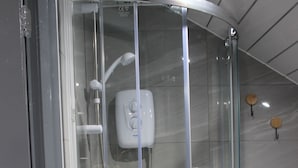 A glass-enclosed shower with a handheld showerhead, a handheld shower nozzle, and a handheld shower head. - 6BV Apartment - Bevois Valley (Southampton)