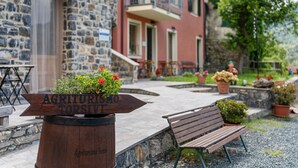 A stone building with a wooden sign reading 'Agriturismo Torso.' - Room 'Cottarze' with Mountain View, Wi-Fi and Air Conditioning (Unknown)