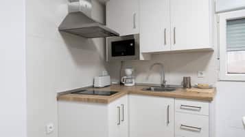 Fridge, microwave, stovetop, coffee/tea maker