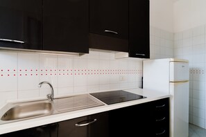 Fridge, coffee/tea maker, cookware/dishes/utensils