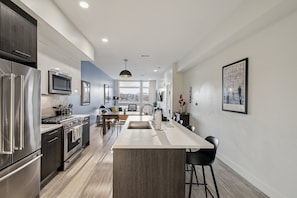 Fridge, microwave, oven, stovetop - Golden Hour | 1BR LoHi Loft | Garage + Balcony | Dog-Friendly (Denver)