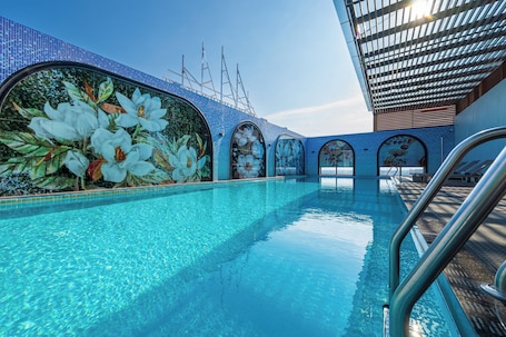 Indoor pool, open 6:00 AM to 10:00 PM, pool umbrellas, sun loungers