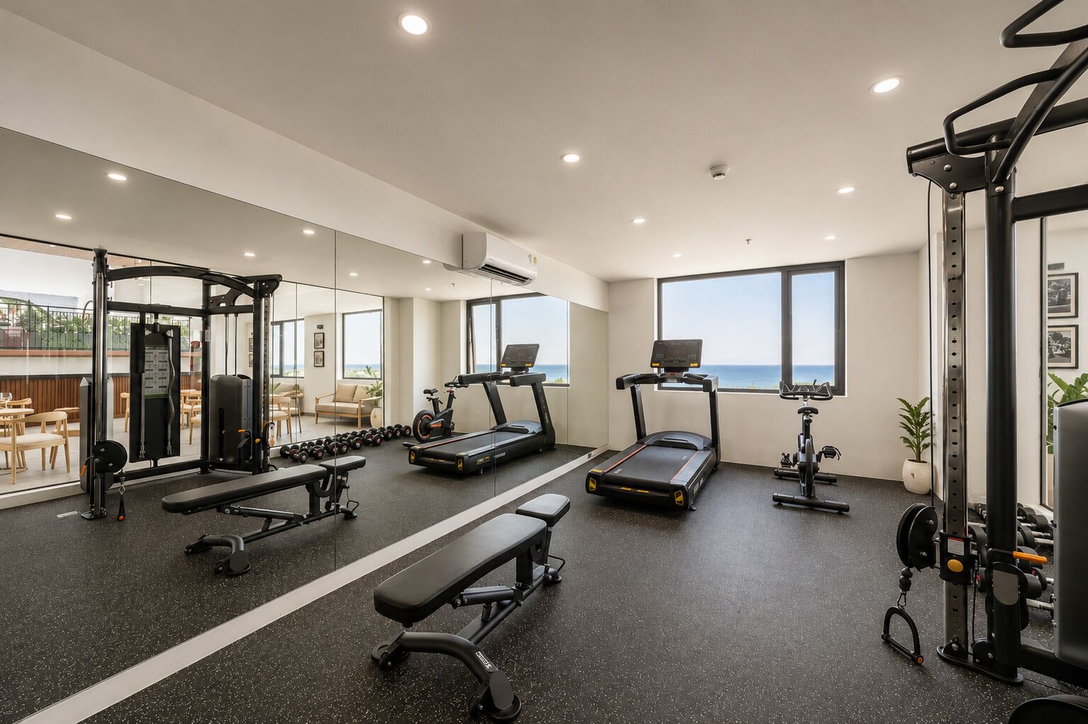 A gym with treadmills, a weight bench, and various exercise machines.