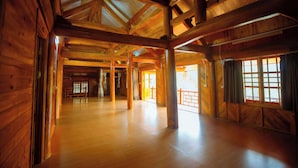 A spacious wooden interior with high ceilings and large windows. - SaPa Village Retreat - Dine & Coffee (Sa Pa)