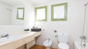 A bathroom with two sinks, a toilet, a bidet, and a shower. - Beach Villa With Private Pool in Llafranc (Palafrugell)