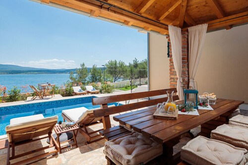 Beachfront villa Noa with heated pool
