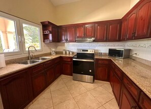Fridge, microwave, stovetop, cookware/dishes/utensils