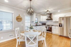 Dishwasher, coffee/tea maker, cookware/dishes/utensils, dining tables - Screened Patio & Fire Pit: Modern Westerville Home (Westerville)