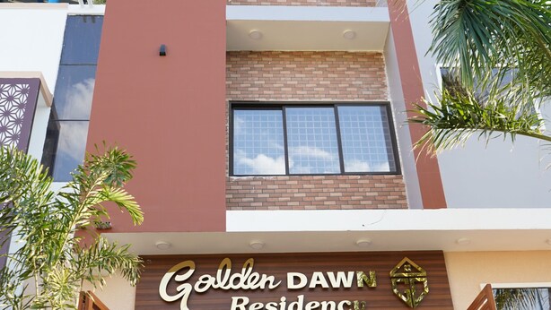 A multi-story building with a prominent entrance labeled "Golden Dawn Residence." - Golden Dawn Residency (Tiruvannamalai)
