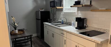 Fridge, microwave, stovetop, coffee/tea maker