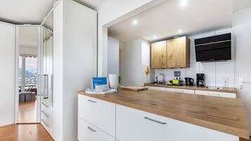 Fridge, microwave, stovetop, coffee/tea maker