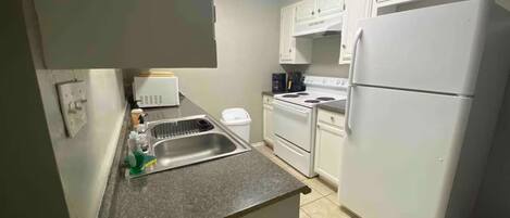 Fridge, microwave, stovetop, coffee/tea maker