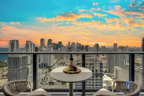 Outdoor dining - Downtown 2BR Oasis: Pool, Gym, Balcony Views (Miami)