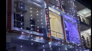 A multi-story building with balconies and a gated entrance. - DhamStay Hotel Shree Bhumi Near SeaBeach (Puri)