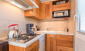 Fridge, oven, coffee/tea maker, toaster