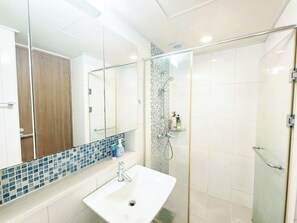 Shower, hair dryer, towels, soap