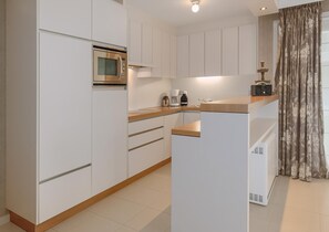 Fridge, oven, coffee/tea maker, dining tables