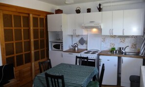 Fridge, microwave, cookware/dishes/utensils