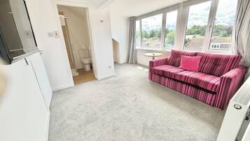 Family Quadruple Room | In-room safe, desk, laptop workspace, iron/ironing board