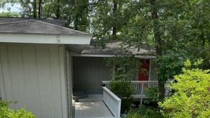 A wooden deck leading to a house with a covered porch. - Quiet Retreat for longer term bookings- Downstairs apartment 5 miles to FSU (Tallahassee)