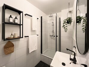 Shower, hair dryer, towels, soap