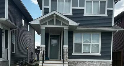 Spacious & Cozy Private Room in a Family Home with Private Washroom.
