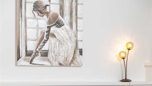 A hotel room with a bed featuring red and white bedding, a framed artwork above the bed, and a bedside table with a lamp. - Beautiful Apartment Red Close to the Beach (Kraljevica)