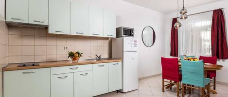 Fridge, microwave, stovetop, coffee/tea maker