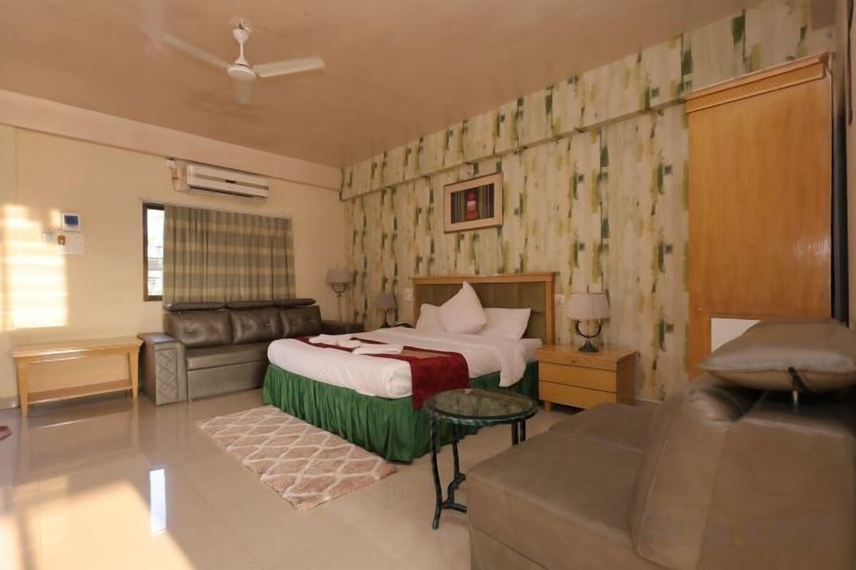 Desk, laptop workspace, bed sheets
