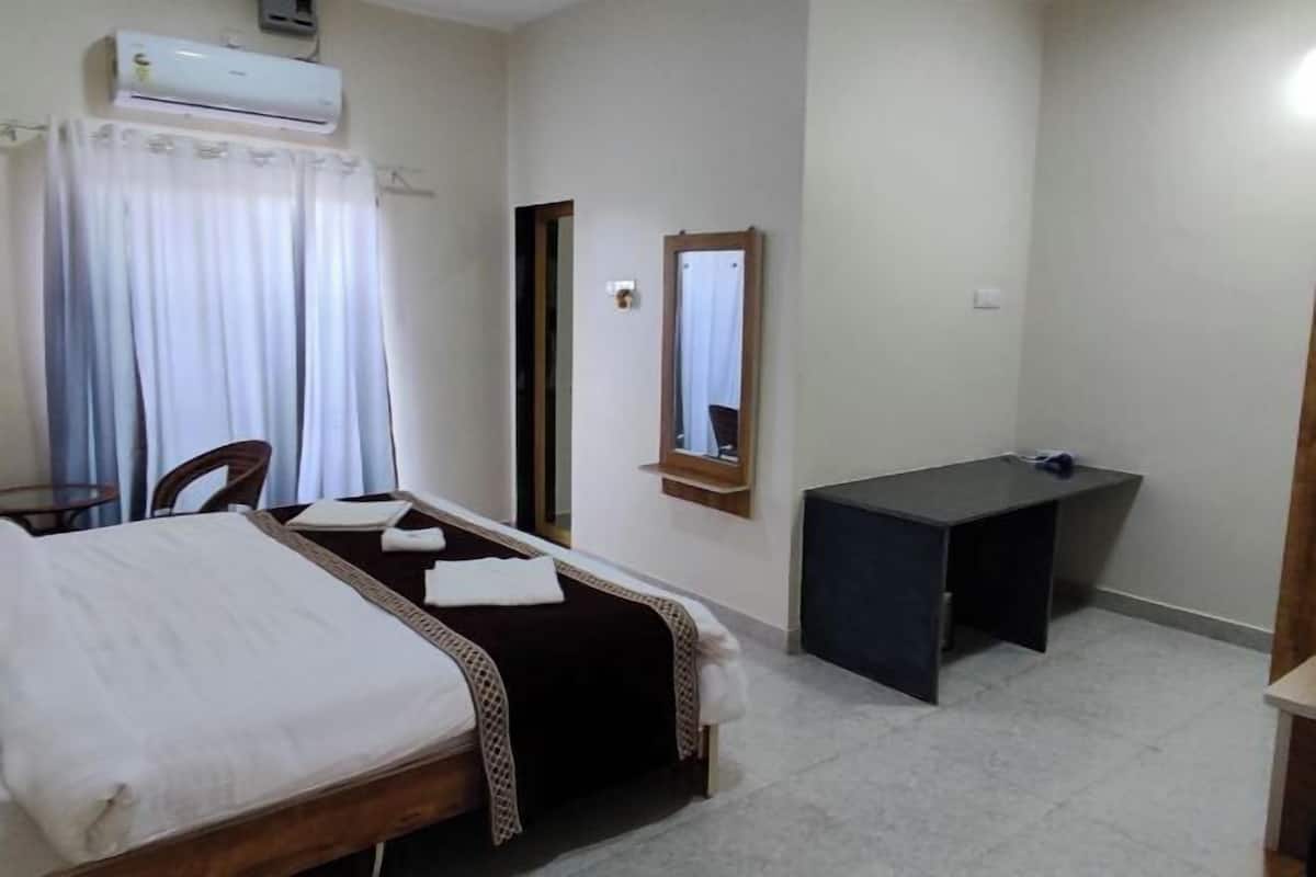 Desk, laptop workspace, bed sheets