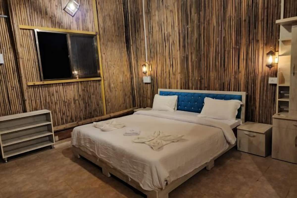 Desk, laptop workspace, bed sheets