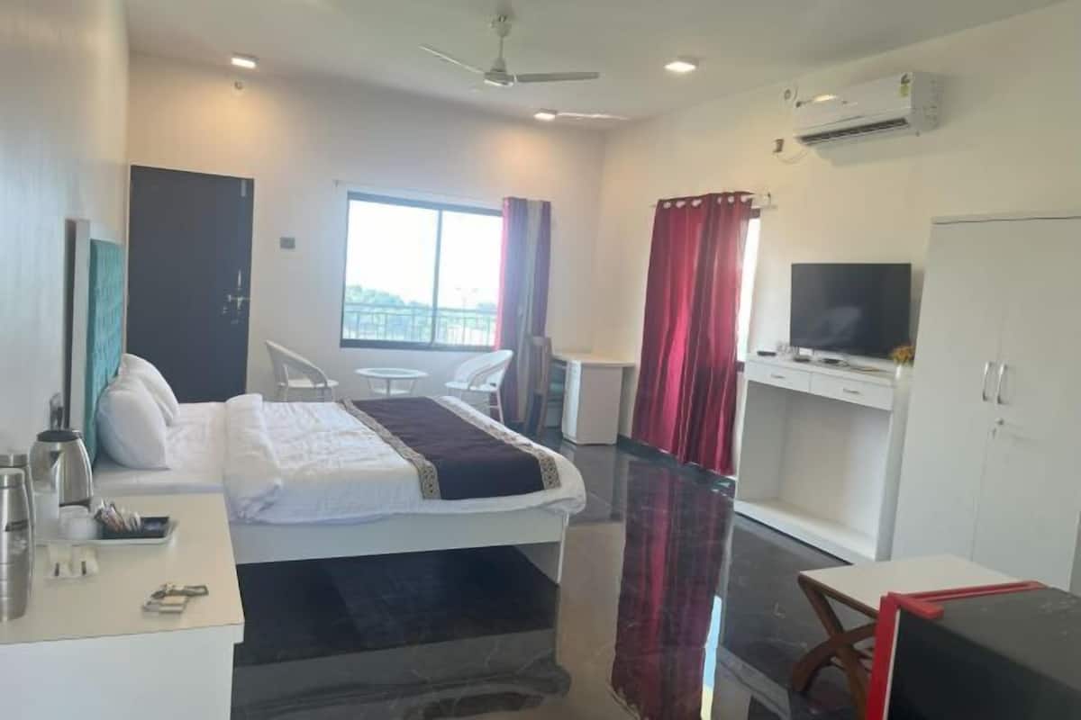 Desk, laptop workspace, bed sheets