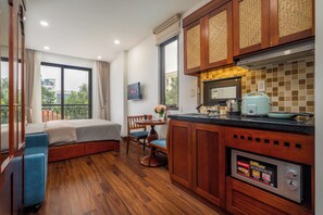 Basic Studio, Balcony, City View | Private kitchen | Full-size fridge, microwave, stovetop, cookware/dishes/utensils - Evelyn Indochine Chic in Central Hanoi (Hanoi)